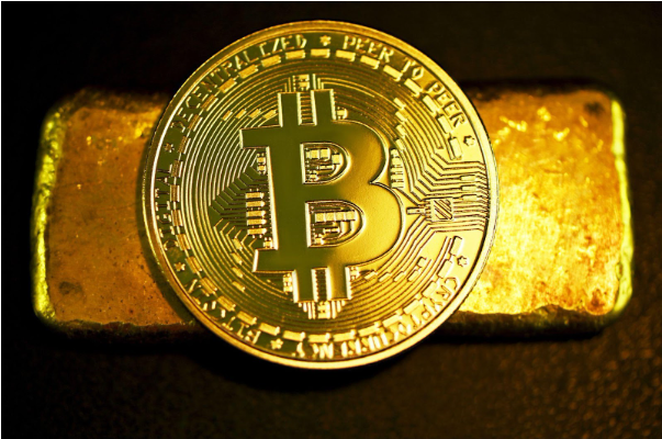 Bitcoin em uma barra de ouro